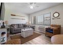 Comfortable living room with couch, chairs, and a beach view at 3509 S Atlantic Ave # 109, New Smyrna Beach, FL 32169