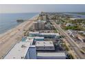 A high rise condo building with an ocean view, overlooking a street at 3615 S Atlantic Ave # 211, Daytona Beach, FL 32118