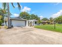 A well-maintained driveway leading to a two-car garage and a charming front entryway at 3626 Donna St, Port Orange, FL 32129