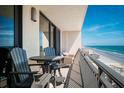 Relaxing balcony with comfortable seating, providing a serene escape and ocean views at 4139 S Atlantic Ave # B508, New Smyrna Beach, FL 32169