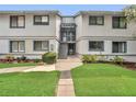 Inviting two-story condo building featuring well-maintained landscaping and easy access to upper-level units at 4403 Sea Mist Dr # 109, New Smyrna Beach, FL 32169