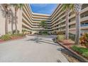 Well maintained condo building entrance with professional landscaping and circular drive at 4555 S Atlantic Ave # 4405, Ponce Inlet, FL 32127