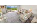 Bright living room with a coastal view and comfortable seating at 4777 S Atlantic Ave # B2, Port Orange, FL 32127