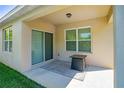 Cozy covered patio with sliding glass doors, an outdoor rug, and a small table, perfect for relaxing at 518 Safe Harbor Dr, Edgewater, FL 32141