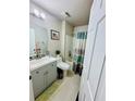 Updated bathroom with a shower-tub combo, vanity with modern sink, and neutral color scheme at 520 Aeolian Dr, New Smyrna Beach, FL 32168