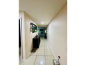 Long hallway with tile floors leading into the living area of the home at 520 Aeolian Dr, New Smyrna Beach, FL 32168
