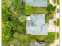 Aerial view showcasing the property's boundaries, mature trees, and landscaped backyard at 757 Hunt Club Trl, Port Orange, FL 32127