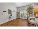 Cozy dining area with hardwood floors, a window, and a view into the kitchen at 850 Wingate Trl, Port Orange, FL 32128