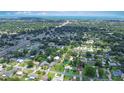Wide aerial shot of a neighborhood with tree-lined streets and single-story homes at 1903 Willow Oak Dr, Edgewater, FL 32141