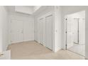 Bedroom featuring tile flooring and neutral paint at 2 Oceans West Blvd # 206, Daytona Beach Shores, FL 32118