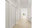 Bright hallway featuring tile floors and closet space at 2 Oceans West Blvd # 206, Daytona Beach Shores, FL 32118