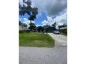 Lovely single story home with manicured front lawn and a paved driveway at 2122 Orange Tree Dr, Edgewater, FL 32141