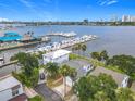 Scenic aerial view of waterfront homes, a full marina, and a restaurant on the water in a vibrant community at 255 Lexington Dr, Daytona Beach, FL 32114