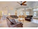 Spacious living room with tile floors, ceiling fan and comfortable seating at 3288 Spruce Creek Gln, Port Orange, FL 32128