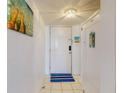 Bright foyer with neutral colors and tile flooring at 4141 S Atlantic Ave # 605, New Smyrna Beach, FL 32169