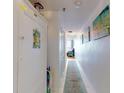 Inviting hallway with updated decor, art and carpeting at 4141 S Atlantic Ave # 605, New Smyrna Beach, FL 32169