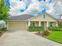 Well-maintained one-story home boasting a manicured lawn, an attached garage, and a classic façade at 6804 Forkmead Ln, Port Orange, FL 32128
