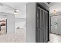 Bright foyer features tile floors, closet, and views into the living space and front door at 800 Black Duck Dr, Port Orange, FL 32127