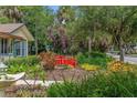Close up of the property's landscaping with a red bridge and a fountain at 807 Craig St, New Smyrna Beach, FL 32168