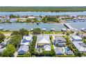 Aerial view showcases the home's waterfront location and the surrounding neighborhood at 1212 S Riverside Dr, New Smyrna Beach, FL 32168