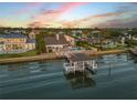 Waterfront home with a dock and boat house for easy access to the open water at 1219 Commodore Dr, New Smyrna Beach, FL 32168