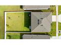 Aerial view of the home featuring a fenced-in backyard, and well-maintained lawn at 2667 Neverland Dr, New Smyrna Beach, FL 32168
