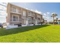 Beautifully maintained condo community features lush lawn and private balconies, creating a tranquil beachside retreat at 2898 Ocean Shore Blvd # 5020, Ormond Beach, FL 32176