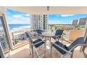 Balcony view with table and chairs, overlooking the ocean and city skyline at 2967 S Atlantic Ave # 508, Daytona Beach, FL 32118