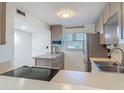 Efficient kitchen with stainless steel appliances and ample counter space at 4155 S Atlantic Ave # 111, New Smyrna Beach, FL 32169
