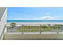 Relax on the spacious balcony with serene views of the ocean and lush coastal landscape at 5207 S Atlantic Ave # 224, New Smyrna Beach, FL 32169