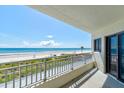 Expansive balcony showcasing panoramic ocean vistas and direct access to the pristine beach at 5207 S Atlantic Ave # 224, New Smyrna Beach, FL 32169