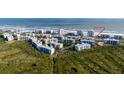 Coastal condo complex with convenient beach access amidst lush greenery and scenic views at 5300 S Atlantic Ave # 5-502, New Smyrna Beach, FL 32169