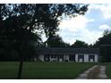 Ranch style home with a carport and spacious yard at 4500 S Hiawassee Rd, Orlando, FL 32835