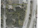 Aerial view of the property highlighting its lot size with mature trees at 966 N Ronald Reagan Blvd, Longwood, FL 32750