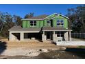 Two-story house under construction with gray siding at 14 Weston Rd, Leesburg, FL 34748