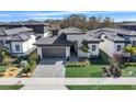 Modern home with gray roof and gray driveway at 3016 Kensington Ave, Davenport, FL 33837