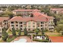 Aerial view of a community with building and pool at 904 Charo Pkwy # 518, Davenport, FL 33897