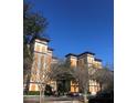 View of building's exterior showcasing its architectural features and design, and a clear blue sky backdrop at 12521 Floridays Resort Dr # 302F, Orlando, FL 32821