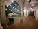 Inviting pool area with string lights and tiled flooring at 800 W 2Nd Ave, Windermere, FL 34786