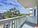 Balcony view of lush, green trees and the surrounding area, offering a serene and picturesque outlook at 400 E Colonial Dr # 203, Orlando, FL 32803