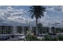 Apartment building with ample parking spaces and black metal fencing, offering both security and aesthetic appeal at 4424 S Texas Ave, Orlando, FL 32839