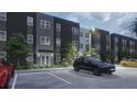 Contemporary apartment complex showcasing ample parking with well-maintained landscaping and a modern design at 4424 S Texas Ave, Orlando, FL 32839