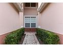 Brick walkway leads to the entrance of the townhome at 1323 Gilford Point Ln # 0, Davenport, FL 33896