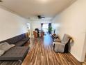 Spacious living room featuring modern flooring and ample natural light streaming through the windows at 4865 Cypress Woods Dr # 2204, Orlando, FL 32811