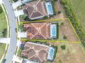 Aerial view of a house with a pool and a large backyard at 6078 Broad Oak Dr, Davenport, FL 33837