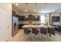 Eat-in kitchen island with sleek countertops and stainless steel appliances at 4189 Lana Ave, Davenport, FL 33897