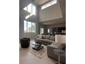 Spacious living room with sectional sofa and high ceilings at 7740 Sandy Ridge Dr # 217, Reunion, FL 34747