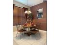 Cozy dining area with decorative lighting, a round table, and comfortable seating for four at 466 Pepin Dr, Orlando, FL 32825