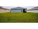 Large backyard with grassy lawn and privacy fence at 1080 Condor Dr, Haines City, FL 33844