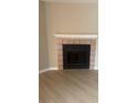 A classic fireplace with a white mantle and tile surround provides a cozy focal point in the living space at 5635 Devonbriar Way # 103, Orlando, FL 32822